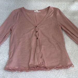 Branded by Pink Rose. Medium in size. The color is a Blush Pink.